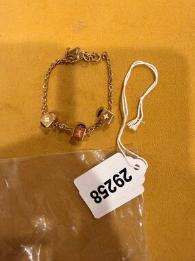 Louis Vuitton Gold-Tone Cube Charm Bracelet with Blue Accents